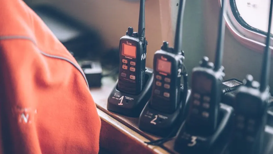 Handheld radio scanners in charging stations, illustrative photo